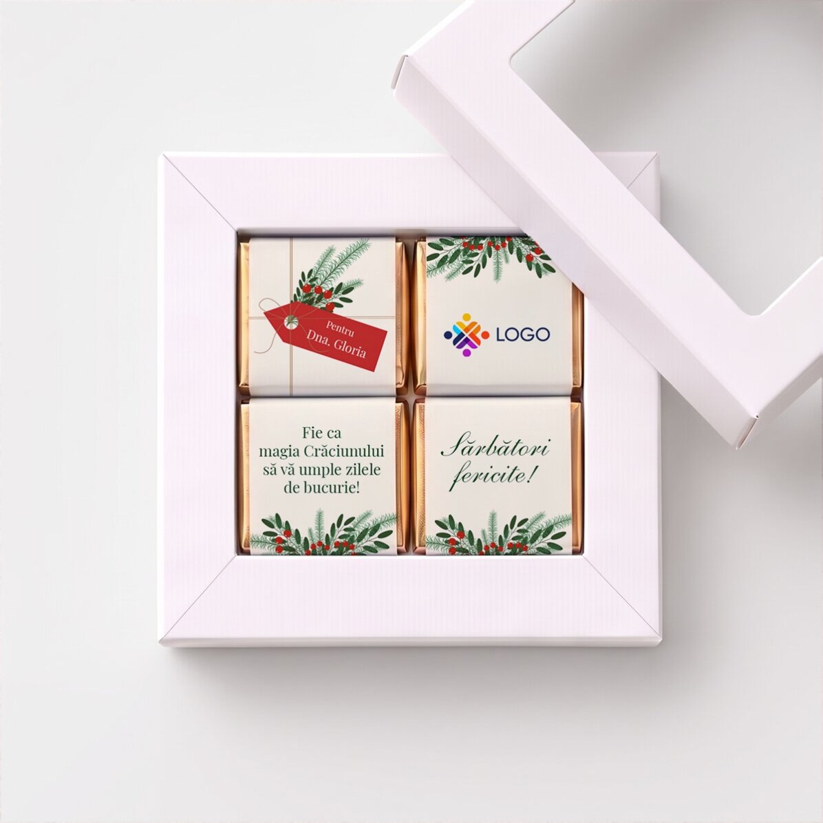Gift box containing 4 mini chocolates, personalised with a logo and a Christmas message