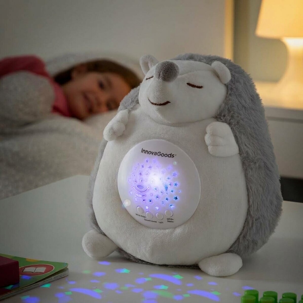 Plush hedgehog toy with light and sound projector
