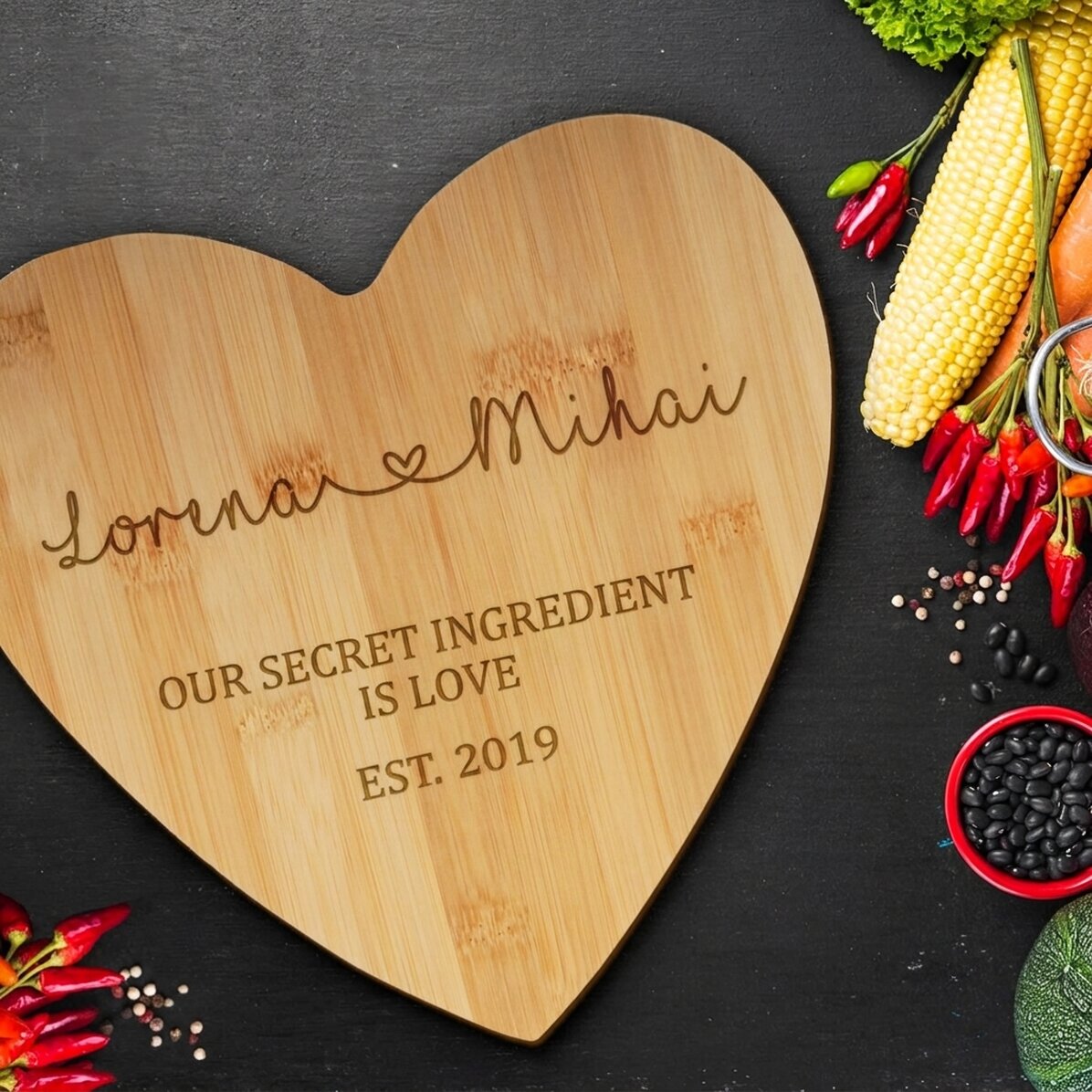 Personalised heart-shaped chopping board for couples