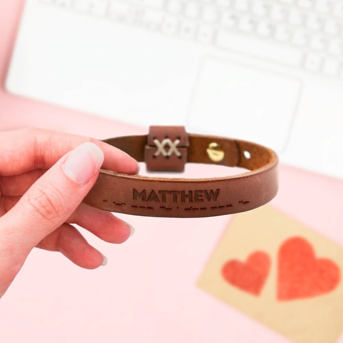 Personalised leather bracelet with the message "I love you" in Morse code