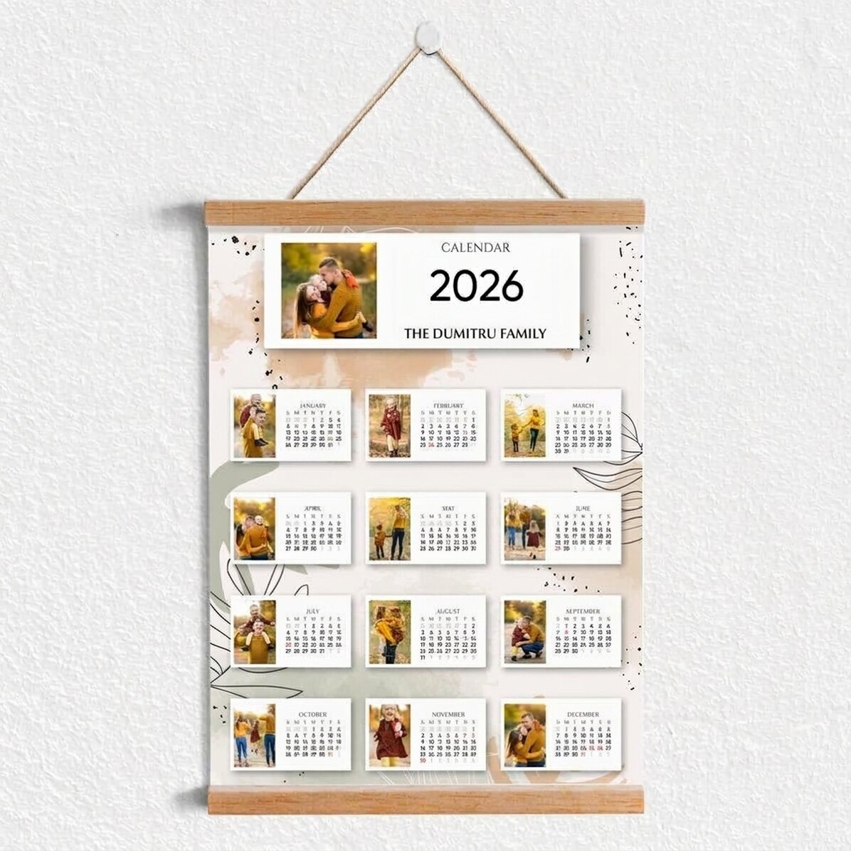 Personalised calendar poster with hangers, featuring 13 photos and text